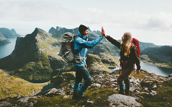 Couple Holds Hands in Mountain as they Experience Nature Before Climate Change